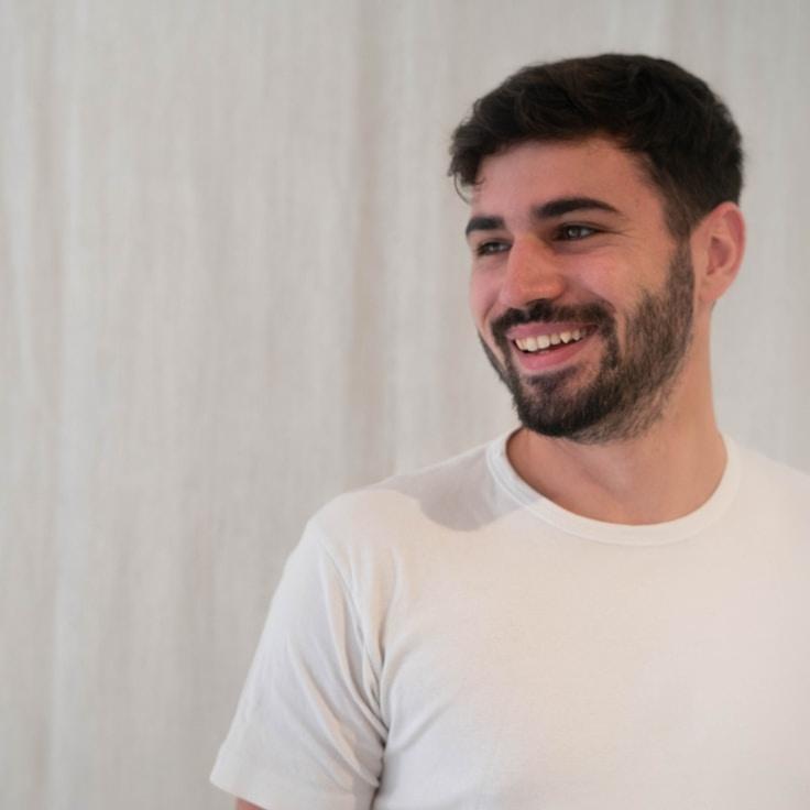 Avery Chen, Lead Design Curator at EmberFernShore, reviewing corporate floral arrangements